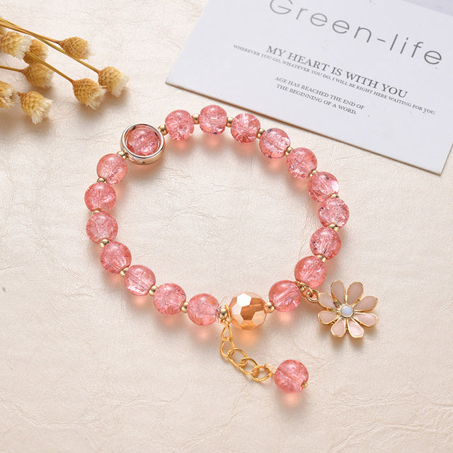 Bracelet de Pierres Rouges et Fleurs de Marguerite en Or