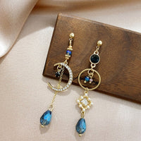 Boucles d'oreilles Lune en Or avec Zirconia Bleu