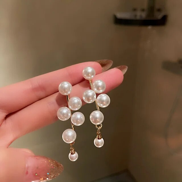 Boucles d'oreilles élégantes en or et perles