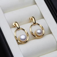 Boucles d'oreilles élégantes en or et perle