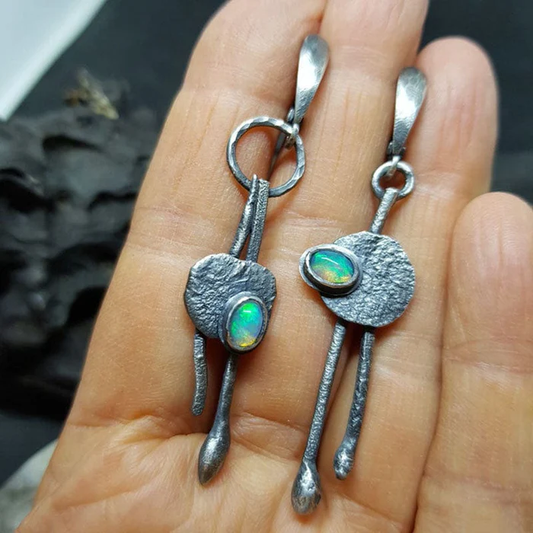 Boucles d'oreilles vintage en argent avec opale bleue
