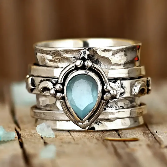 Bague vintage en argent et or avec goutte d'eau bleue